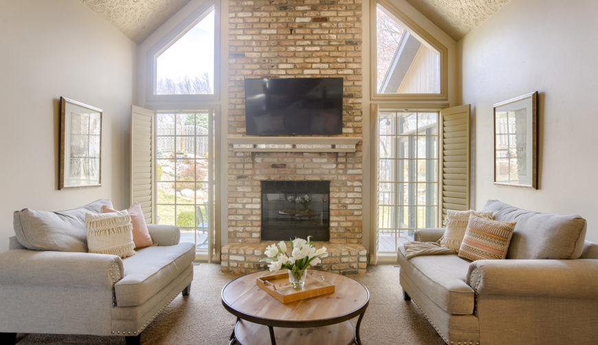 cathedral vaulted ceilings, statement fireplace