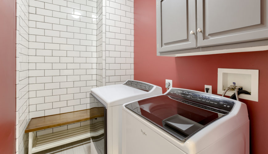 updated laundry room with subway tile