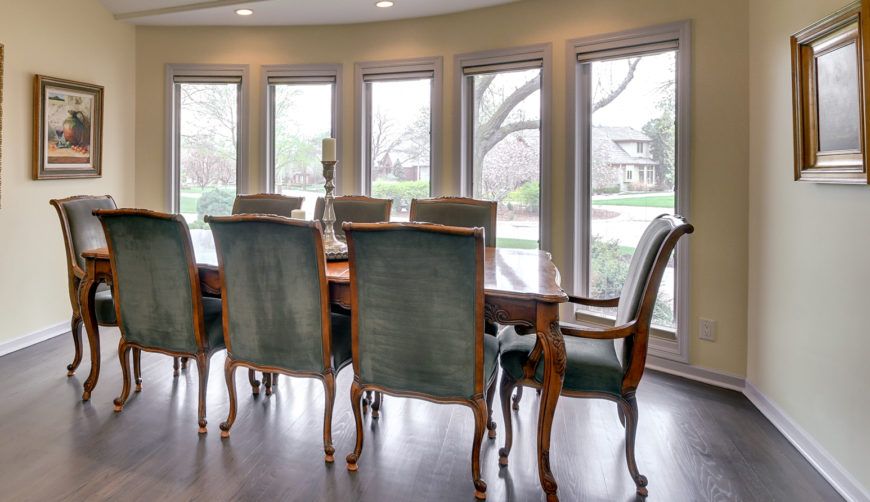 Formal dining room with floor to ceiling windows